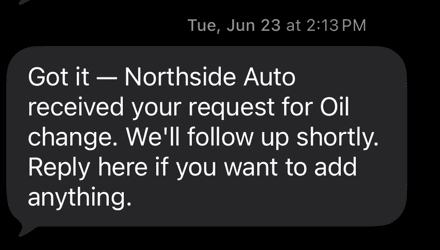Cropped NorthTen Front Desk SMS acknowledging an oil-change request for Northside Auto